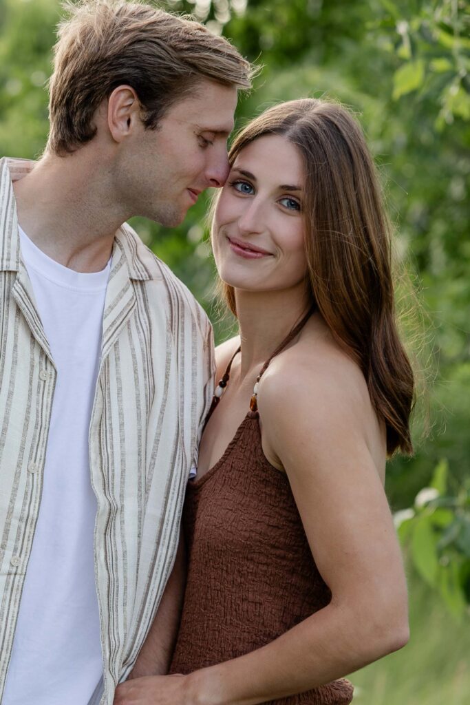 A couple smiling. Minnesota engagement session at Spring Lake Park in Hastings, Minnnesota.